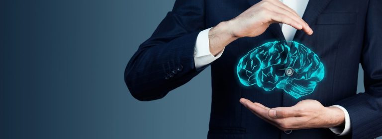 Man in suit holding blue outline of brain